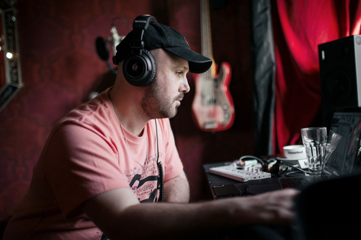 Gethin Pearson in his studio with ADAM Audio Studio Pro SP-5 headphones.
